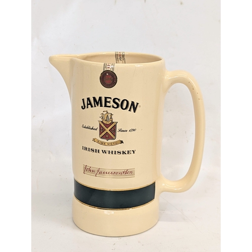 410 - A vintage Jameson Irish Whiskey water jug. 15x16.5cm