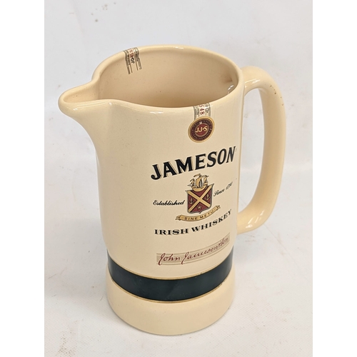 410 - A vintage Jameson Irish Whiskey water jug. 15x16.5cm