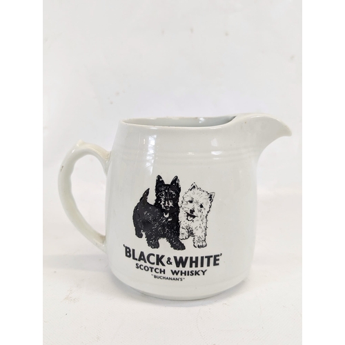 411 - A vintage Black & White Scotch Whisky water jug. 17.5x12.5cm