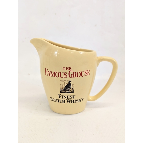 413 - A vintage The Famous Grouse Scotch Whisky water jug by Wade. 17x13.5cm