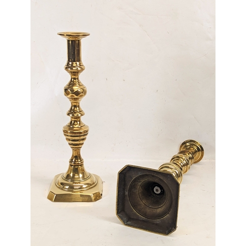 415 - A pair of large Victorian brass candlesticks. 35cm