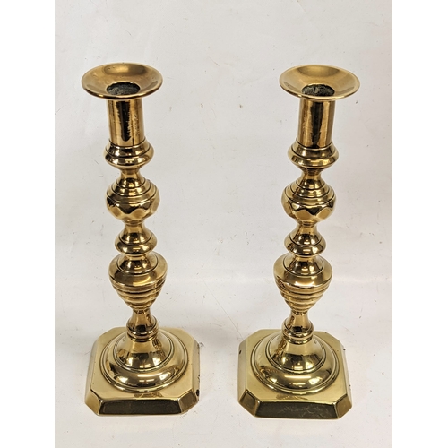 415 - A pair of large Victorian brass candlesticks. 35cm