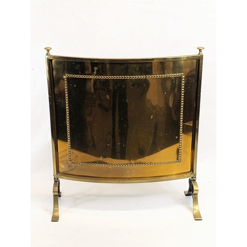 106 - An early 20th century brass fire screen. 53x 60.5cm