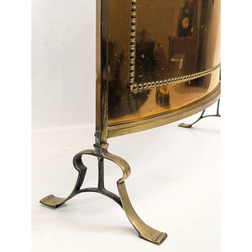 106 - An early 20th century brass fire screen. 53x 60.5cm