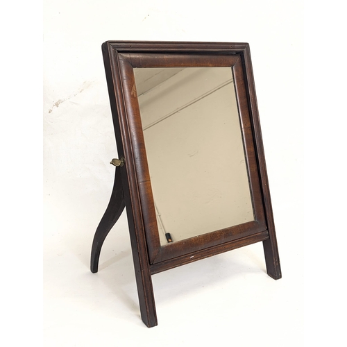 107 - A late Georgian mahogany dressing mirror. 57cm