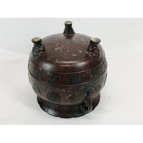 118 - A 19th century Chinese bronze 2 handled pot. 27 x 22cm