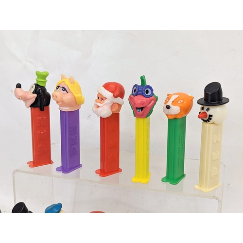 120 - A quantity of vintage character PEZ candy dispensers. Including Donald Duck, Goofy, Bugs Bunny Wonde... 