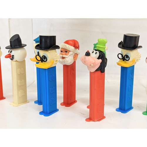 120 - A quantity of vintage character PEZ candy dispensers. Including Donald Duck, Goofy, Bugs Bunny Wonde... 