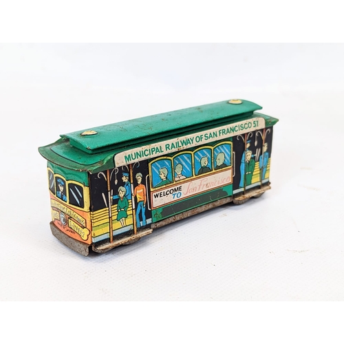 127 - A vintage tin toy of San Francisco train by Litho, made in Japan. With 2 vintage tin wind-up toys, R... 