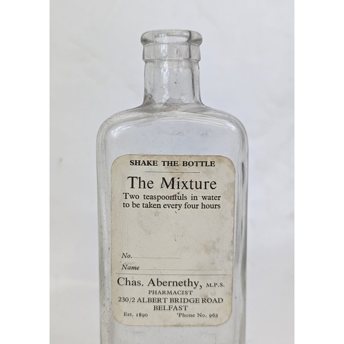 134 - Five early 20th century glass chemist bottles, from Abernethy Pharmacy on the Albert Bridge Road, Be... 