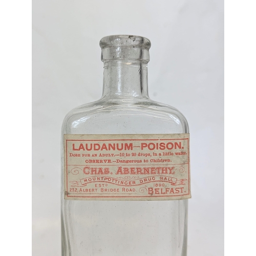 134 - Five early 20th century glass chemist bottles, from Abernethy Pharmacy on the Albert Bridge Road, Be... 