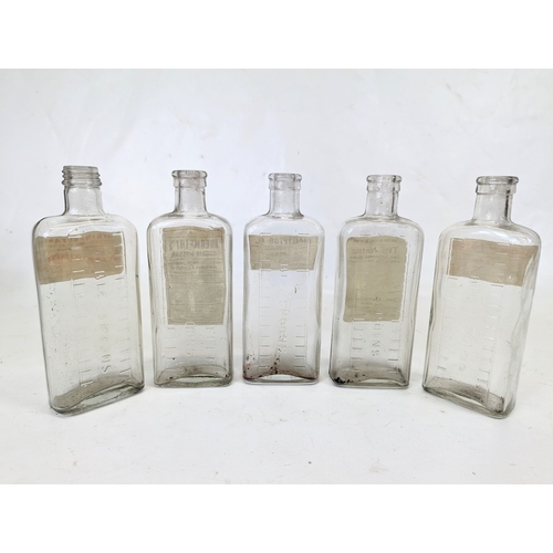 134 - Five early 20th century glass chemist bottles, from Abernethy Pharmacy on the Albert Bridge Road, Be... 