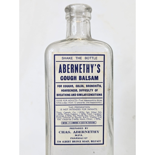 134 - Five early 20th century glass chemist bottles, from Abernethy Pharmacy on the Albert Bridge Road, Be... 