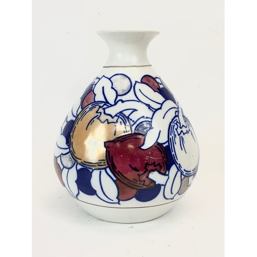 421 - A 1920’s Charlotte Rhead “Fruit” lustre vase for Burleigh Ware. 17cm