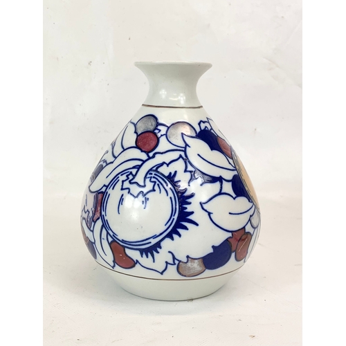 421 - A 1920’s Charlotte Rhead “Fruit” lustre vase for Burleigh Ware. 17cm