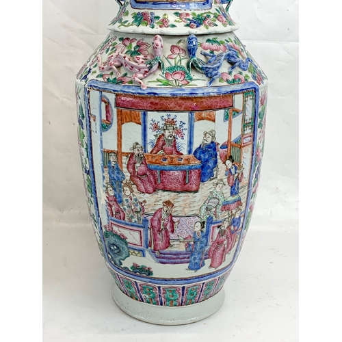 426 - A pair of large 19th century Chinese Famile Rose Canton Vases. 26 x 62.5cm.