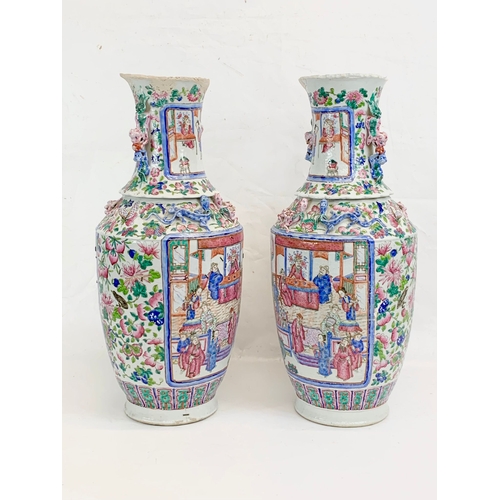 426 - A pair of large 19th century Chinese Famile Rose Canton Vases. 26 x 62.5cm.