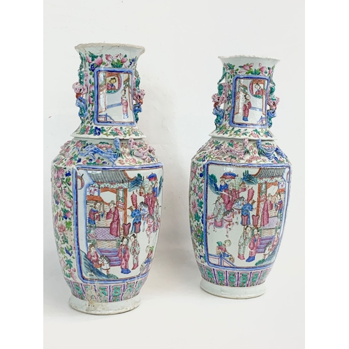 426 - A pair of large 19th century Chinese Famile Rose Canton Vases. 26 x 62.5cm.