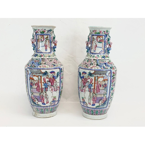 426 - A pair of large 19th century Chinese Famile Rose Canton Vases. 26 x 62.5cm.