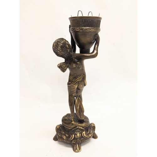 136 - A vintage bronze cherub candle holder. 24cm