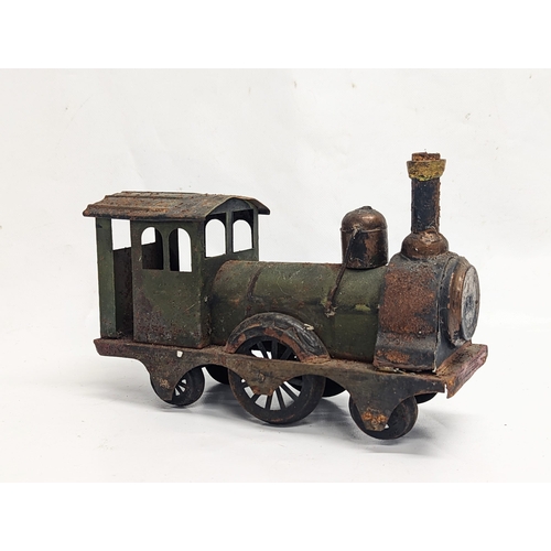 137 - 3 vintage car models, with a vintage model steam train. Largest measures 34cm in length.