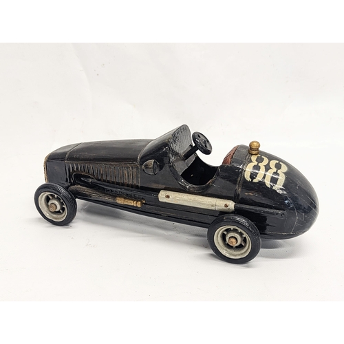 137 - 3 vintage car models, with a vintage model steam train. Largest measures 34cm in length.