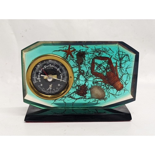 139 - A decorative French resin mantle barometer. 17.5x11.5cm