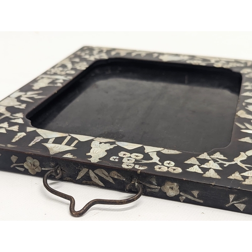 140 - An early 20th century Chinese hanging frame inlaid with Mother of Pearl. 21.5x25cm