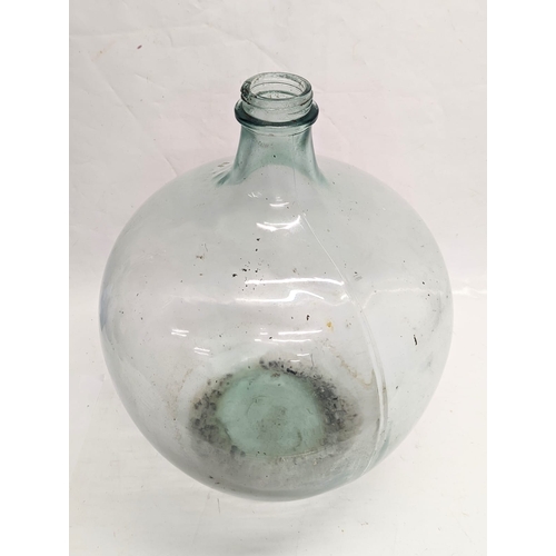 145 - A large early 20th century glass carboy. 42x55cm