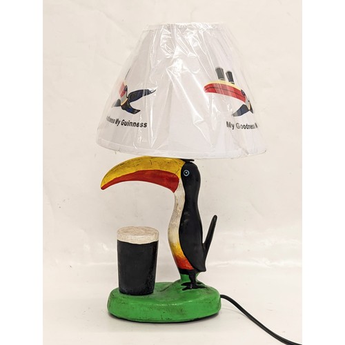 147 - A Guinness Toucan lamp. Including shade, 38cm