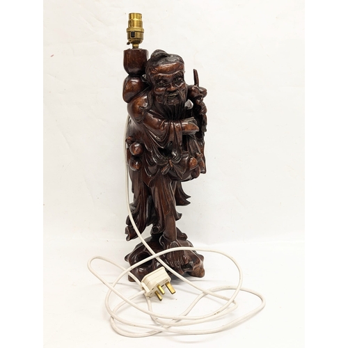 149 - A large carved Chinese table lamp. 51cm