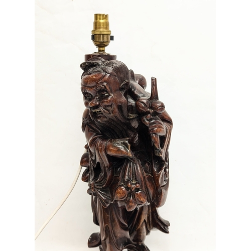 149 - A large carved Chinese table lamp. 51cm