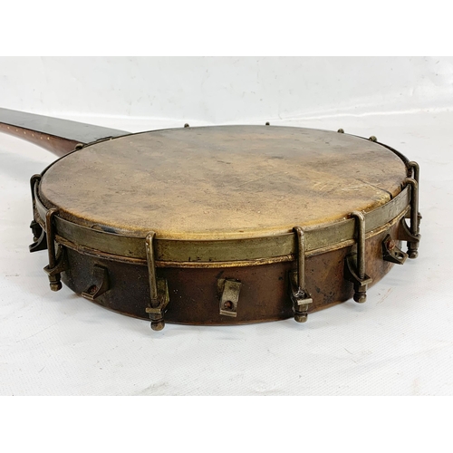 157 - A late 19th century rosewood banjo. 88cm