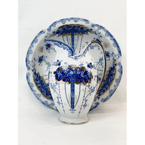 438 - A large Sevres style blue and white porcelain jug and bowl. Bowl measures 38cm. Jug measures 28cm