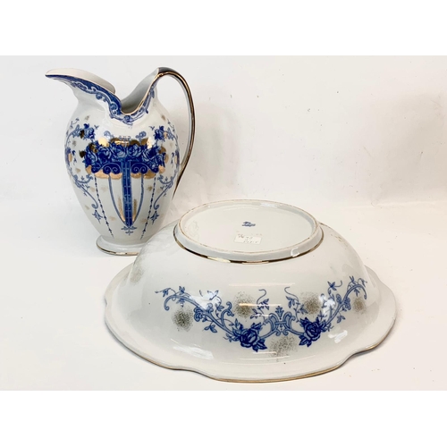 438 - A large Sevres style blue and white porcelain jug and bowl. Bowl measures 38cm. Jug measures 28cm