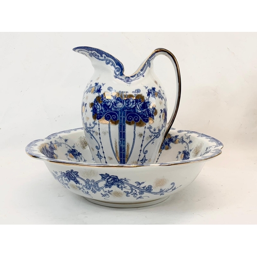 438 - A large Sevres style blue and white porcelain jug and bowl. Bowl measures 38cm. Jug measures 28cm