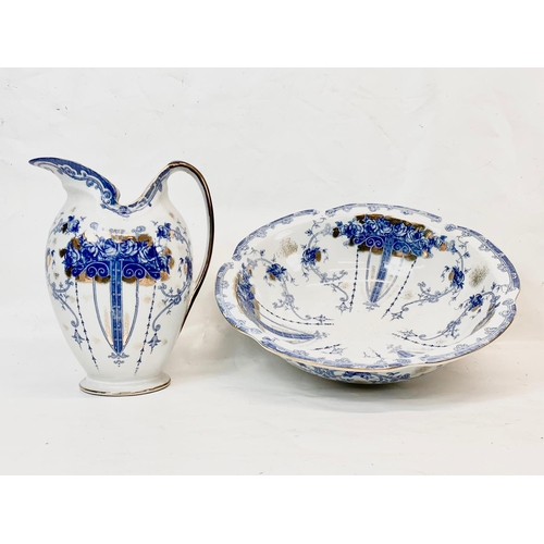 438 - A large Sevres style blue and white porcelain jug and bowl. Bowl measures 38cm. Jug measures 28cm