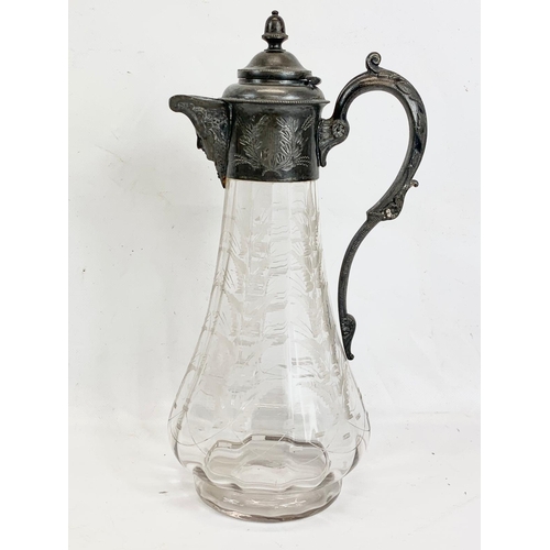 443 - A Victorian silver plated claret jug with etched glass. 31cm