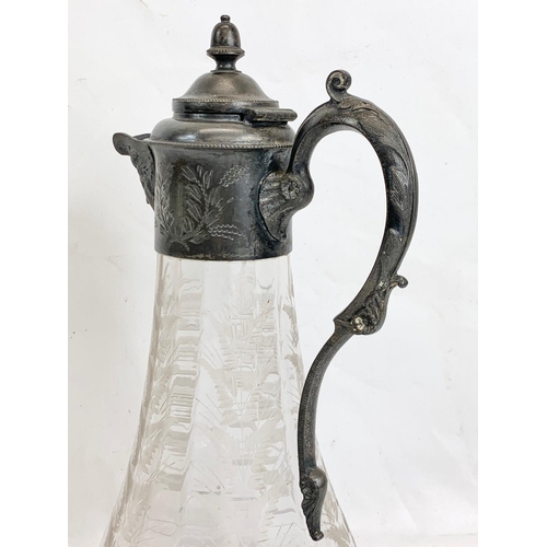 443 - A Victorian silver plated claret jug with etched glass. 31cm