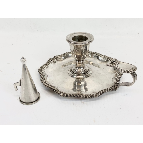 444 - A Victorian silver plated chamberstick, a cruet set and serving spoons in case.