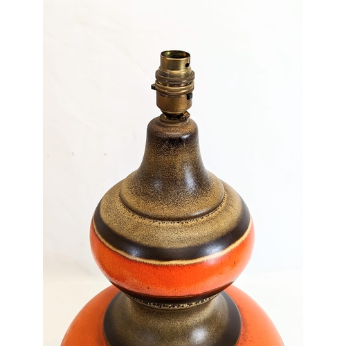 455 - A large West German pottery table lamp with shade. Marked 385-40. Without shade 24x45cm