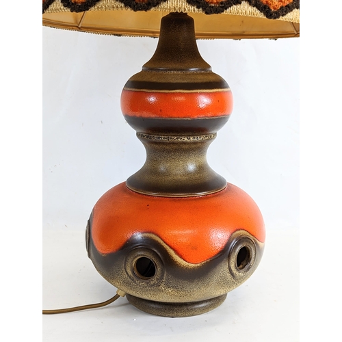 455 - A large West German pottery table lamp with shade. Marked 385-40. Without shade 24x45cm