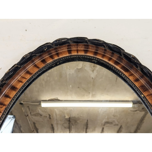 178 - A large Edwardian oval mirror. 51.5x79cm