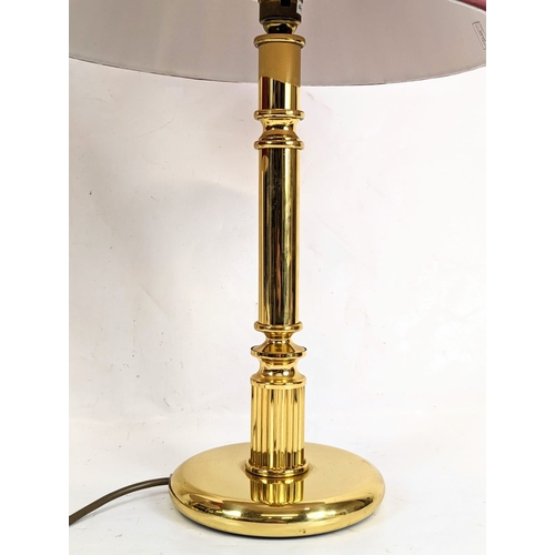 181 - A pair of brass table lamps. Tallest measures 38.5cm