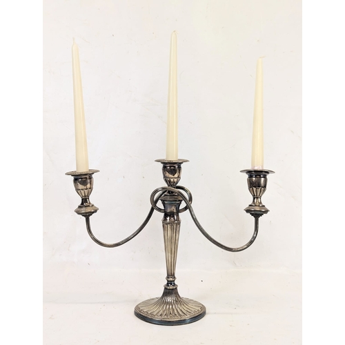 463 - A Regency style silver plate candlestick. 37x28cm