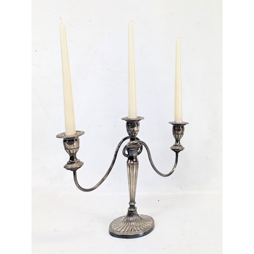 463 - A Regency style silver plate candlestick. 37x28cm