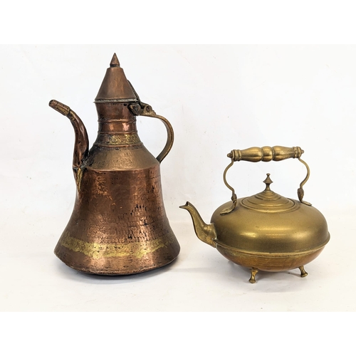 185 - A Victorian brass kettle with an early 20th century copper kettle. 22x35cm