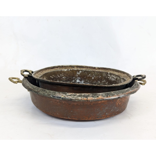 187 - 2 early 20th century copper pans. Largest measures 37cm