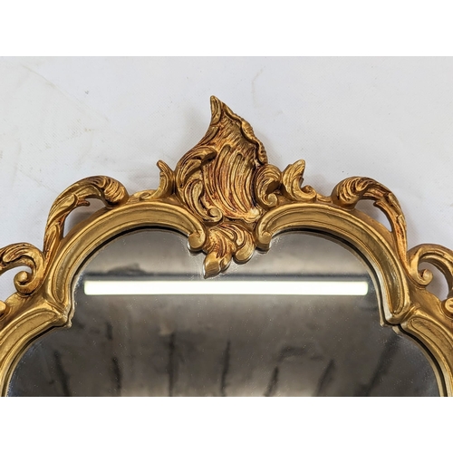 188 - An ornate gilt framed mirror. 33x46.5cm