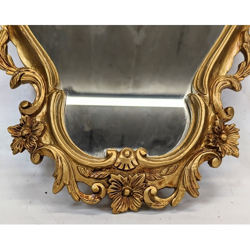 188 - An ornate gilt framed mirror. 33x46.5cm